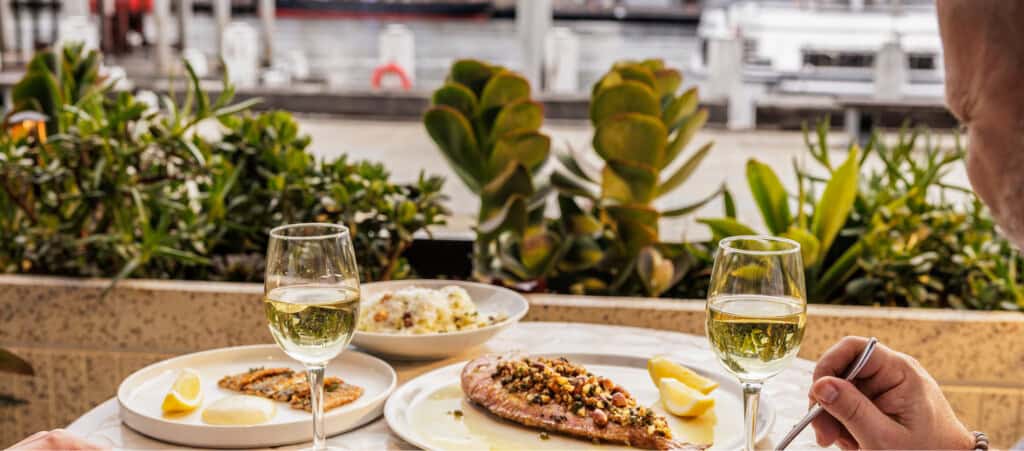 Georges: Food on table with waterfront views